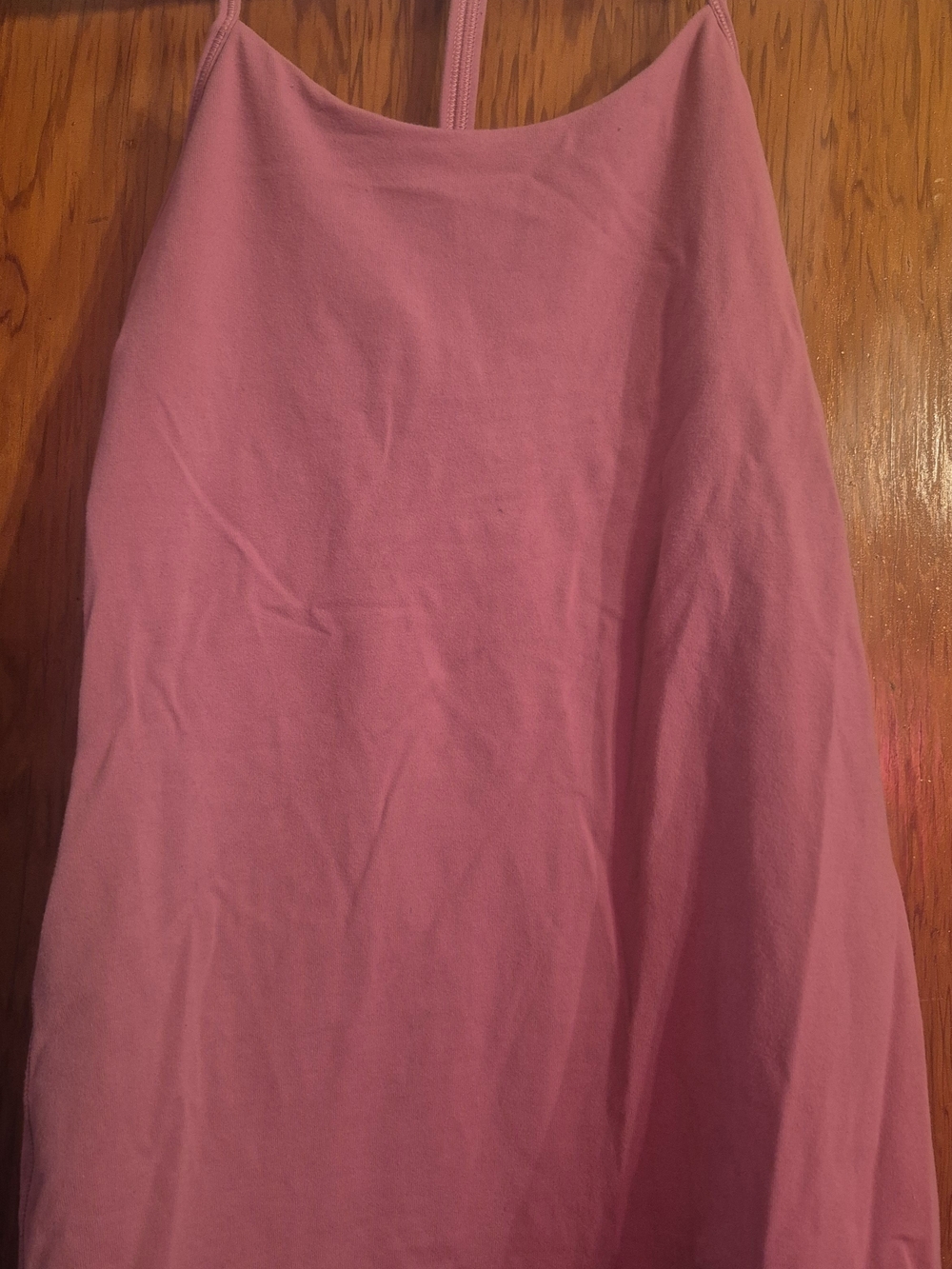 Lululemon pink spaghetti strap tank with a minimalist style.